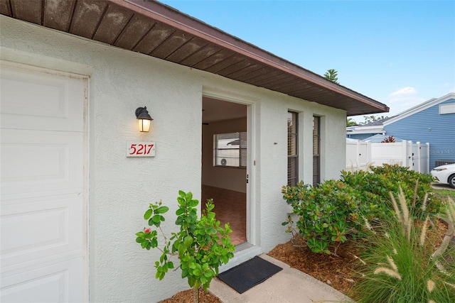 5217 29th Ave S, Gulfport, FL 33707 - property entrance with stucco siding and a garage