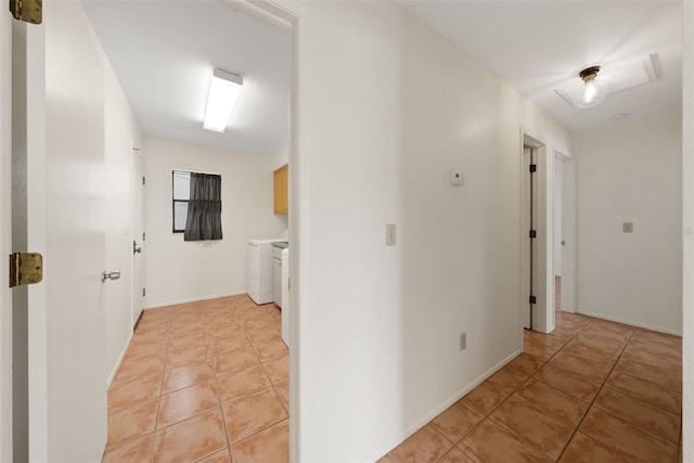 5217 29th Ave S, Gulfport, FL 33707 - hall with light tile patterned flooring and washer and dryer