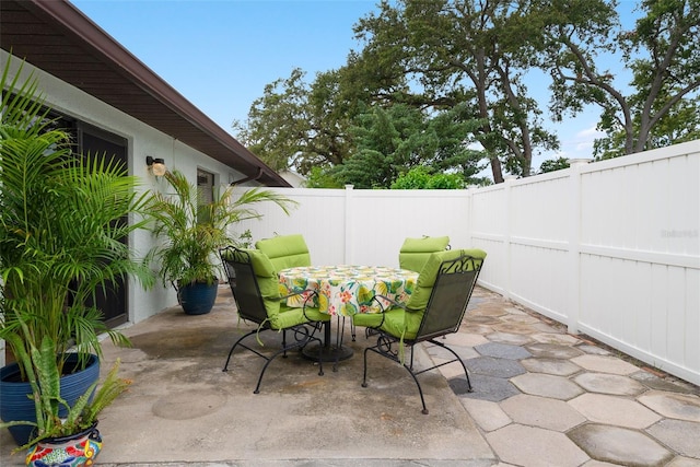 5217 29th Ave S, Gulfport, FL 33707 - fenced backyard featuring a patio area and outdoor dining area