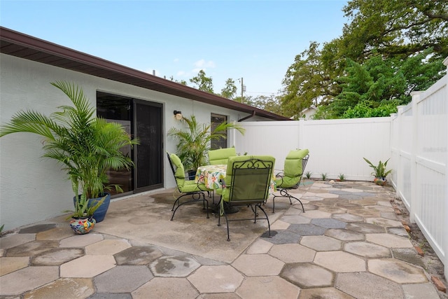5217 29th Ave S, Gulfport, FL 33707 - fenced backyard with a patio and outdoor dining area