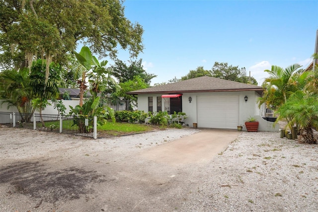 5217 29th Ave S, Gulfport, FL 33707 - view of front of home with stucco siding and driveway