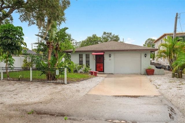 5217 29th Ave S, Gulfport, FL 33707 - view of front of property featuring stucco siding, concrete driveway, an attached garage, and roof with shingles