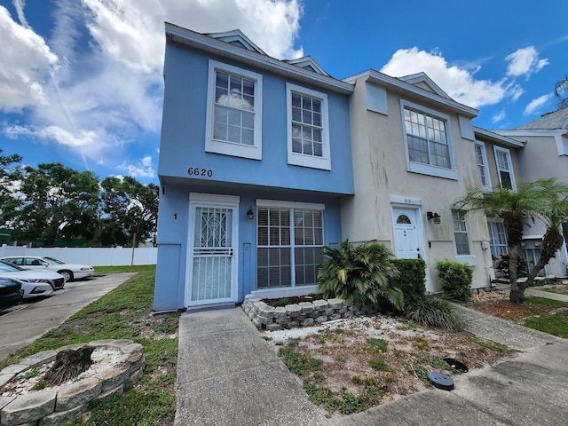 6620 121st Ave Unit 1, Largo, FL 33773 - townhome / multi-family property featuring stucco siding and a fire pit