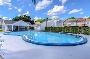 6620 121st Ave Unit 1, Largo, FL 33773 - community pool featuring a patio area