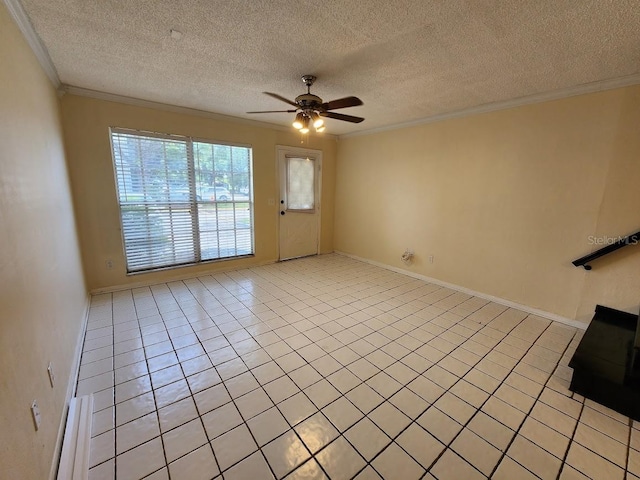 6620 121st Ave Unit 1, Largo, FL 33773 - unfurnished living room featuring ornamental molding, a ceiling fan, a textured ceiling, and light tile patterned floors