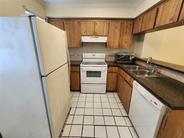 6620 121st Ave Unit 1, Largo, FL 33773 - kitchen featuring white appliances, under cabinet range hood, brown cabinets, dark countertops, and ornamental molding