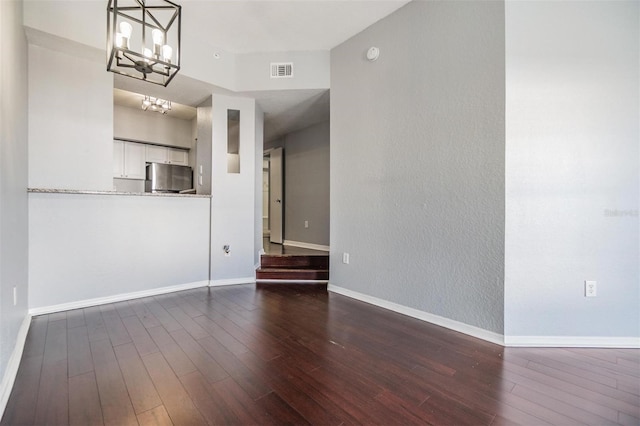 501 S Moody Ave Unit 1134, Tampa, FL 33609 - unfurnished living room with a chandelier and dark wood finished floors