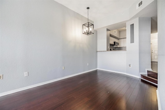 501 S Moody Ave Unit 1134, Tampa, FL 33609 - spare room with dark wood-style floors, a chandelier, and stairway