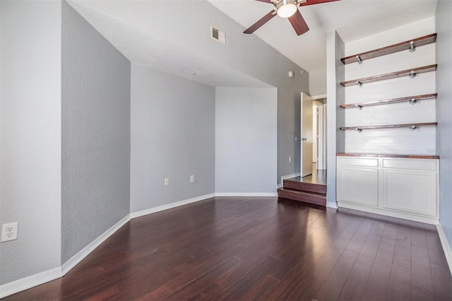 501 S Moody Ave Unit 1134, Tampa, FL 33609 - unfurnished living room featuring a ceiling fan, dark wood-type flooring, and a textured wall