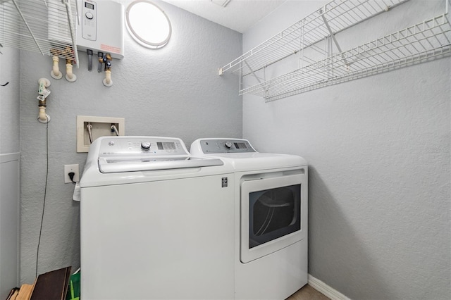 501 S Moody Ave Unit 1134, Tampa, FL 33609 - laundry room featuring washing machine and dryer and a textured wall