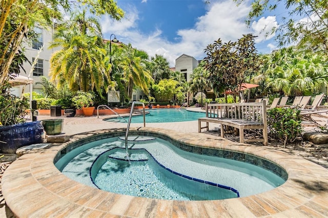 501 S Moody Ave Unit 1134, Tampa, FL 33609 - community pool featuring a hot tub and a patio