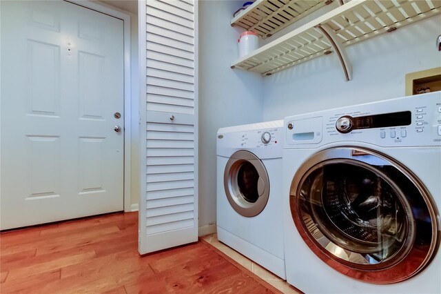 6105 Bahia Del Mar Cir Unit 388, Saint Petersburg, FL 33715 - laundry room with separate washer and dryer and light wood-type flooring
