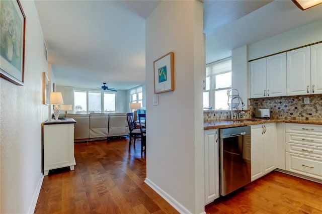 6105 Bahia Del Mar Cir Unit 388, Saint Petersburg, FL 33715 - kitchen featuring dishwasher, white cabinets, decorative backsplash, wood finished floors, and ceiling fan