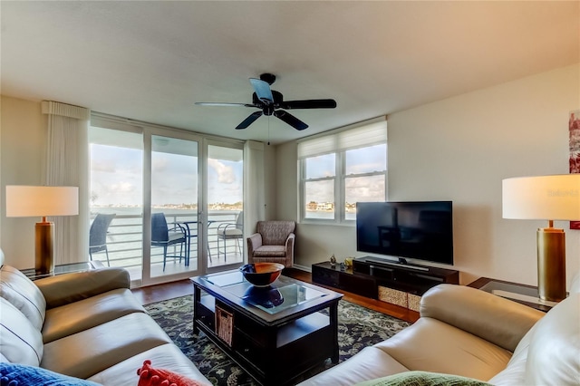 6105 Bahia Del Mar Cir Unit 388, Saint Petersburg, FL 33715 - living room featuring healthy amount of natural light, ceiling fan, and wood finished floors