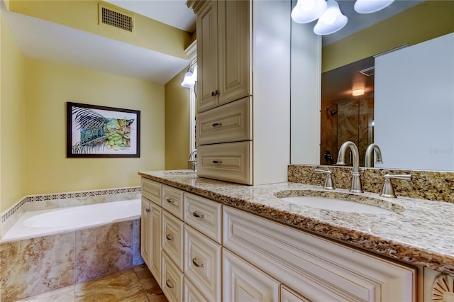 6105 Bahia Del Mar Cir Unit 388, Saint Petersburg, FL 33715 - full bathroom with double vanity, a garden tub, and a stall shower