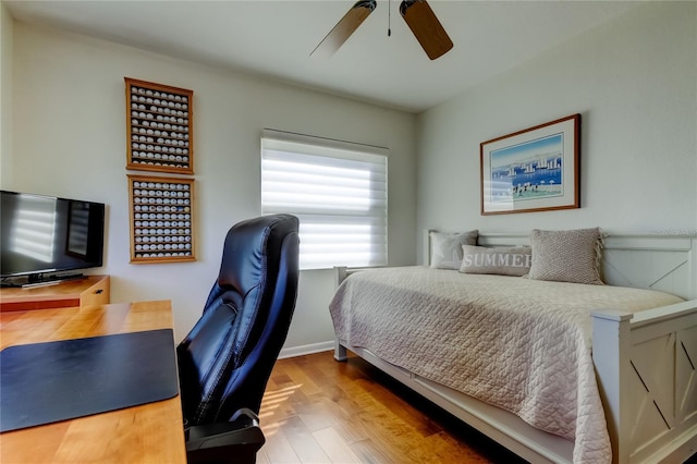 6105 Bahia Del Mar Cir Unit 388, Saint Petersburg, FL 33715 - bedroom with an office area, wood finished floors, and ceiling fan