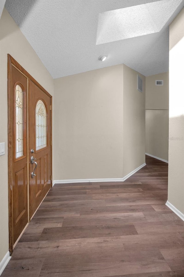 11279 Oakridge Trl, Seminole, FL 33772 - foyer entrance featuring wood finished floors and a textured ceiling