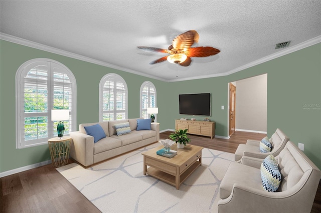 11279 Oakridge Trl, Seminole, FL 33772 - living area with wood finished floors, ornamental molding, ceiling fan, and a textured ceiling