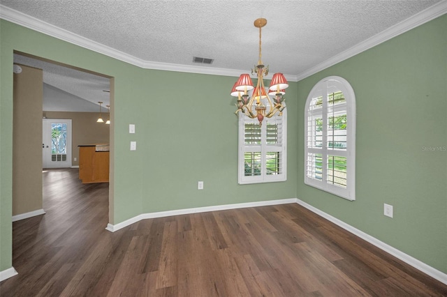 11279 Oakridge Trl, Seminole, FL 33772 - unfurnished room featuring dark wood finished floors, a textured ceiling, a chandelier, and ornamental molding