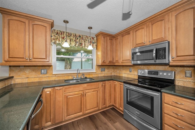 11279 Oakridge Trl, Seminole, FL 33772 - kitchen featuring appliances with stainless steel finishes, dark wood-style flooring, brown cabinets, and a textured ceiling