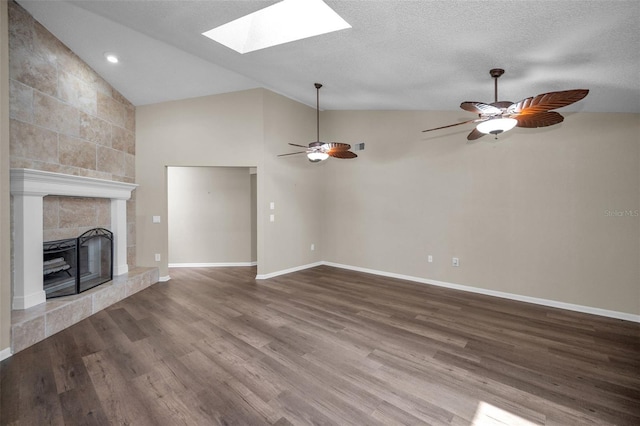 11279 Oakridge Trl, Seminole, FL 33772 - unfurnished living room featuring lofted ceiling, a skylight, wood finished floors, a fireplace, and a ceiling fan