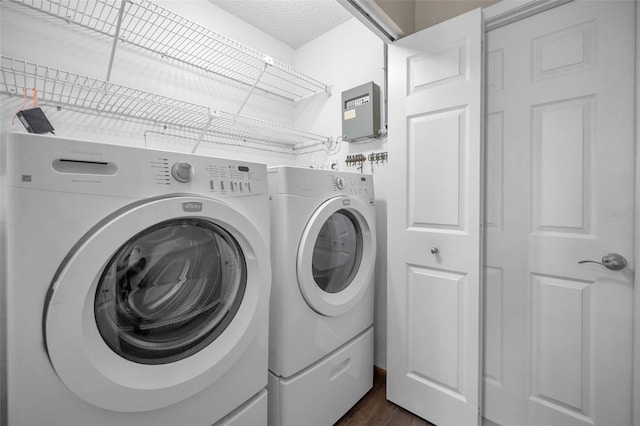 11279 Oakridge Trl, Seminole, FL 33772 - laundry room with independent washer and dryer and dark wood-type flooring