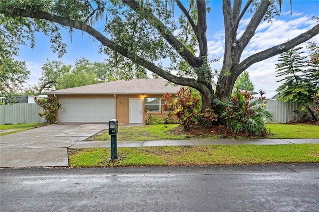 523 Northride Trl, Lakeland, FL 33813 - view of front of property with a garage, driveway, and brick siding
