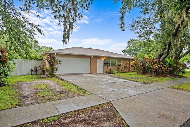 523 Northride Trl, Lakeland, FL 33813 - view of front of home with a garage, driveway, and brick siding