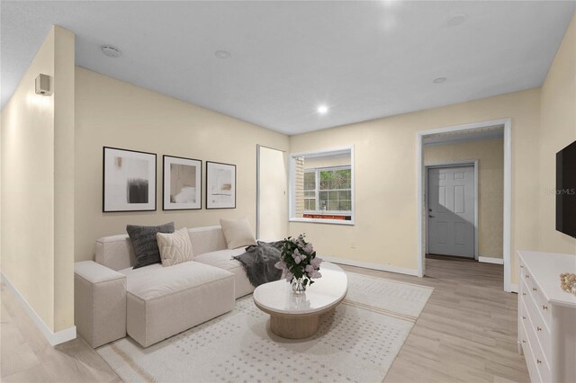 523 Northride Trl, Lakeland, FL 33813 - living room featuring light wood-style flooring and recessed lighting