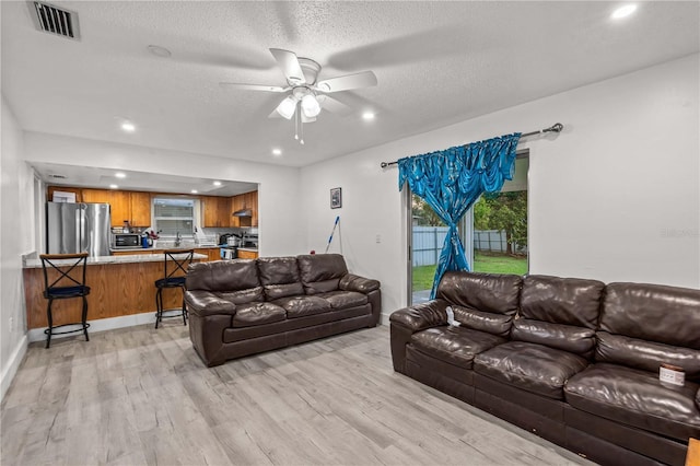 523 Northride Trl, Lakeland, FL 33813 - living area with light wood-style floors, ceiling fan, recessed lighting, and a textured ceiling