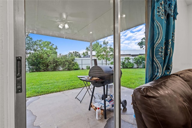 523 Northride Trl, Lakeland, FL 33813 - fenced backyard featuring a patio, a ceiling fan, and a grill