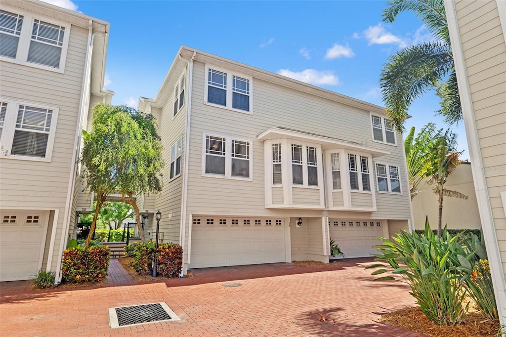 3315 W De Leon St Unit 19, Tampa, FL 33609 - view of front of house with a garage and decorative driveway