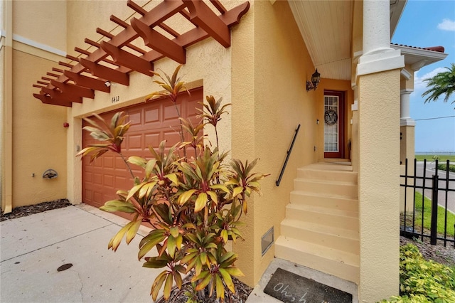 6412 Mayra Shores Ln, Apollo Beach, FL 33572 - view of exterior entry featuring stucco siding and a garage