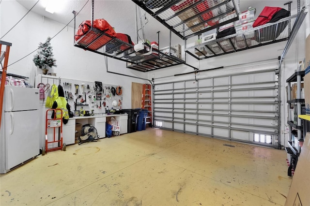 6412 Mayra Shores Ln, Apollo Beach, FL 33572 - garage featuring freestanding refrigerator and a garage door opener
