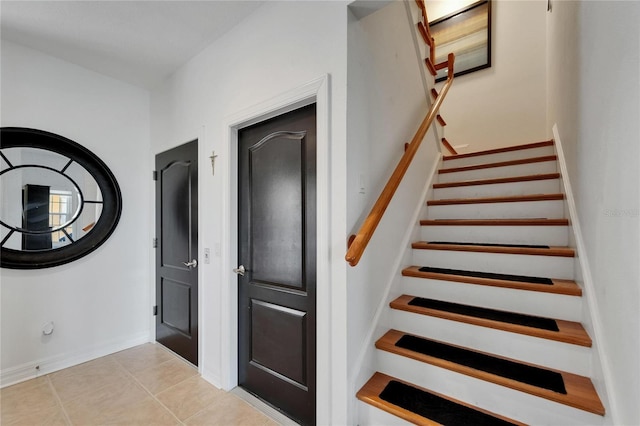 6412 Mayra Shores Ln, Apollo Beach, FL 33572 - stairway with tile patterned floors and baseboards