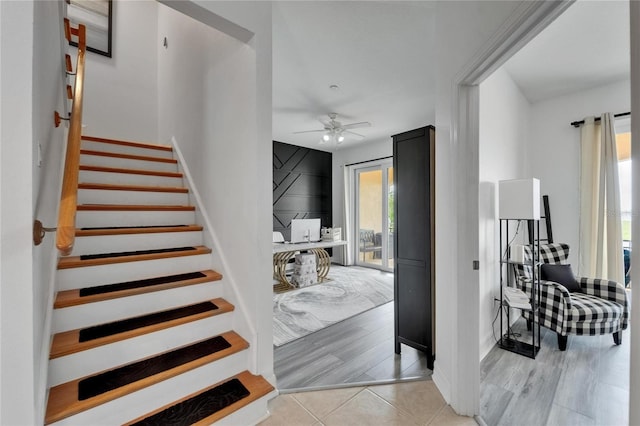 6412 Mayra Shores Ln, Apollo Beach, FL 33572 - stairway featuring a ceiling fan and tile patterned flooring