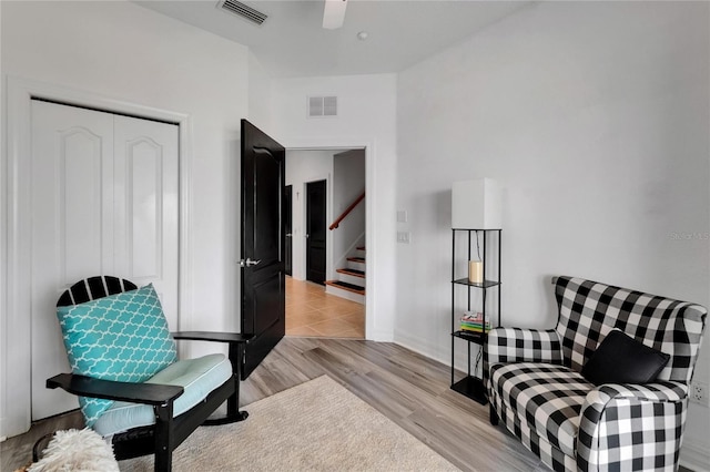 6412 Mayra Shores Ln, Apollo Beach, FL 33572 - sitting room featuring stairs, light wood-style flooring, and ceiling fan