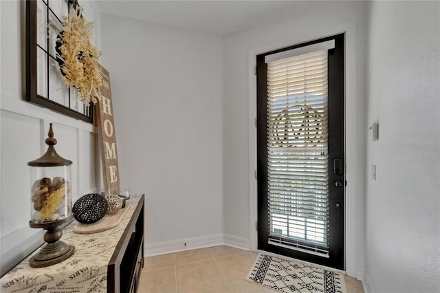 6412 Mayra Shores Ln, Apollo Beach, FL 33572 - entryway with light tile patterned floors and baseboards