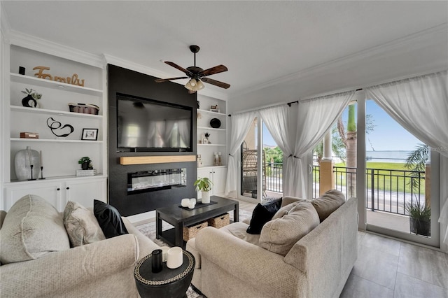 6412 Mayra Shores Ln, Apollo Beach, FL 33572 - living area with ornamental molding, a fireplace, a ceiling fan, and built in shelves