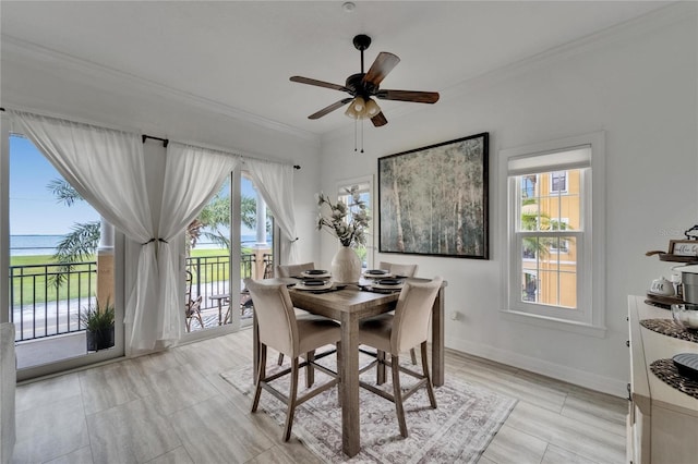 6412 Mayra Shores Ln, Apollo Beach, FL 33572 - dining area featuring a ceiling fan, ornamental molding, and a water view