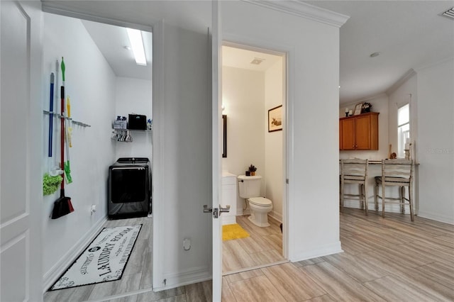 6412 Mayra Shores Ln, Apollo Beach, FL 33572 - hallway with ornamental molding and light wood-style flooring