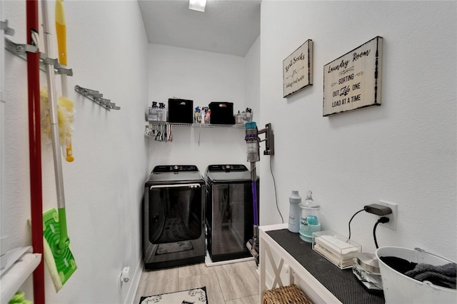 6412 Mayra Shores Ln, Apollo Beach, FL 33572 - washroom featuring washing machine and clothes dryer and wood finished floors