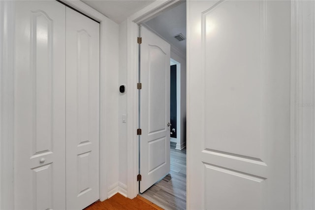 6412 Mayra Shores Ln, Apollo Beach, FL 33572 - hallway with light wood-type flooring and baseboards