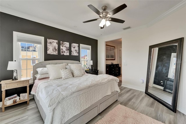 6412 Mayra Shores Ln, Apollo Beach, FL 33572 - bedroom with multiple windows, light wood-type flooring, crown molding, and a ceiling fan