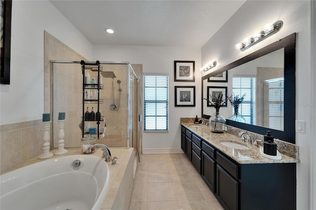 6412 Mayra Shores Ln, Apollo Beach, FL 33572 - bathroom featuring a bath, a stall shower, double vanity, and tile patterned floors