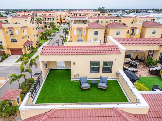 6412 Mayra Shores Ln, Apollo Beach, FL 33572 - back of property featuring stucco siding, a tile roof, and a garage