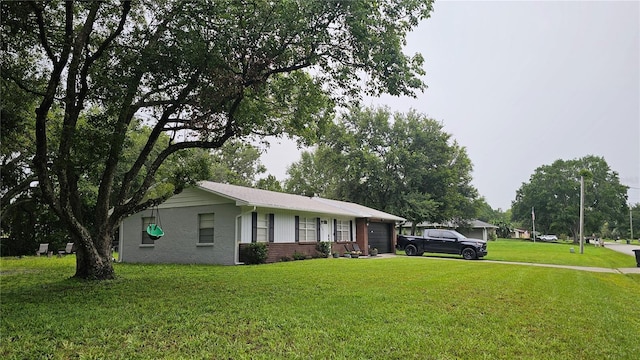 5623 Southernview Dr, Zephyrhills, FL 33541 - ranch-style home with an attached garage, a front yard, and brick siding