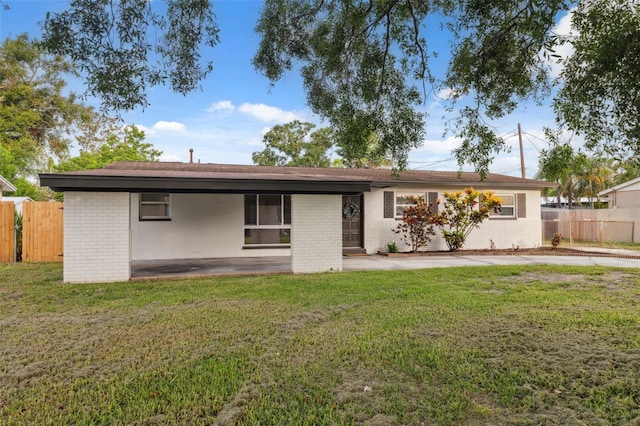 8256 Lark St, Seminole, FL 33777 - view of front facade featuring brick siding and a patio
