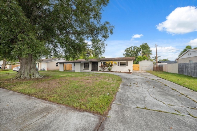 8256 Lark St, Seminole, FL 33777 - ranch-style home with concrete driveway and stucco siding
