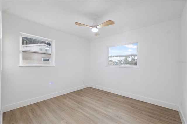 8256 Lark St, Seminole, FL 33777 - spare room with light wood finished floors and ceiling fan